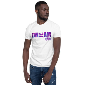 District ink “DREAM” white t-shirt. Design includes large purple galaxy-like lettering reading "Dream" with the "E" of Dream replaced by the DC flag.
